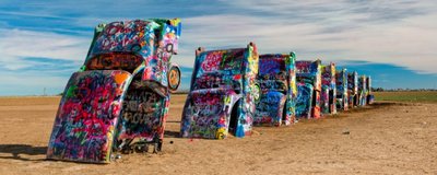 Cadillac-Ranch-off-Interstate-40-Amarillo-Texas-©-Glenn-Nagel-Dreamstime-28439514-e1424449111936-1000x399.jpg