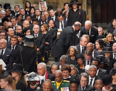 62564359-11226915-US_President_Joe_Biden_is_seen_standing_next_to_his_seat_as_Fren-a-196_1663584594055.jpg