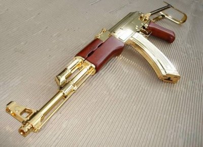 Saddam-Hussein-Gold-Guns-1[1].jpg